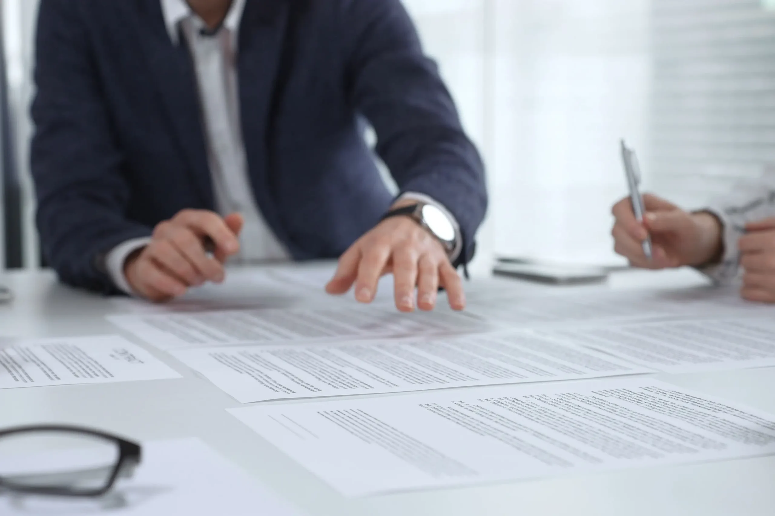 Business team reviewing and evaluating proposal documents during a healthcare analytics RFP process